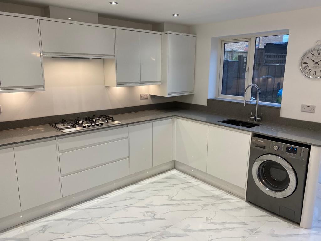 New Kitchen Fitted with white cupboards and a decorative marble floor in Tingley by Chris Ward Plumbing & Heating New Kitchen Fitted with white cupboards and a decorative marble floor in Tingley by Chris Ward Plumbing & Heating